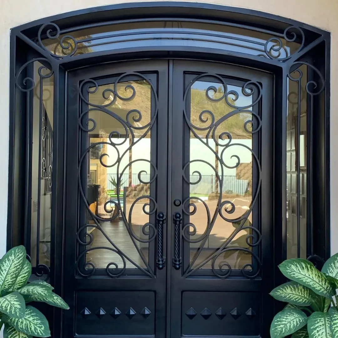 Entry iron door with water glass over bronze glass and oil rubbed bronze finish