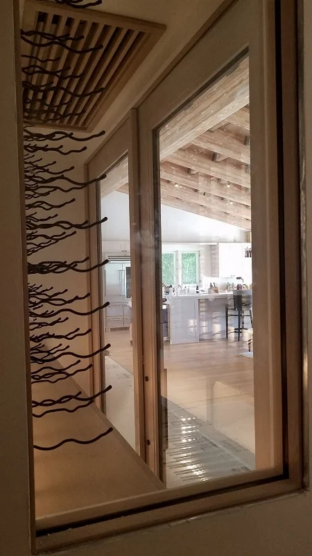 Custom iron scrollwork over a large window opening
