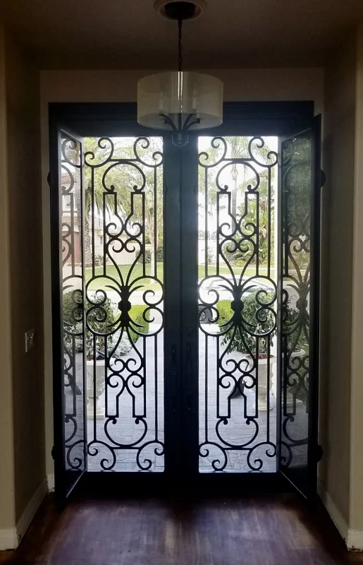 Ornamental iron double entry doors with matching transom