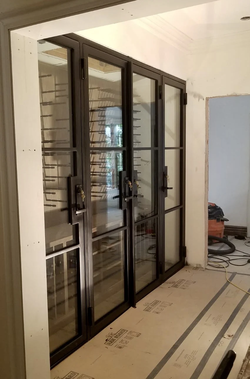 Multi-panel black iron and glass door wall